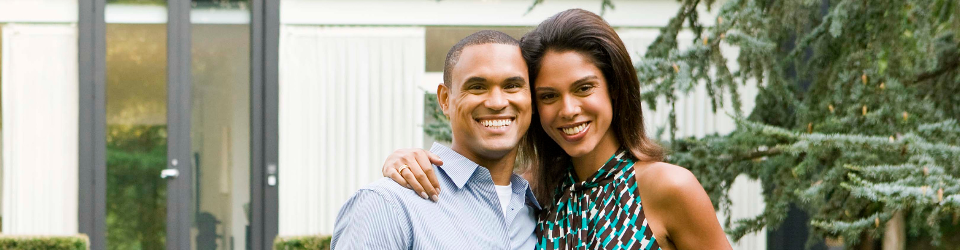 A man and woman smiling.