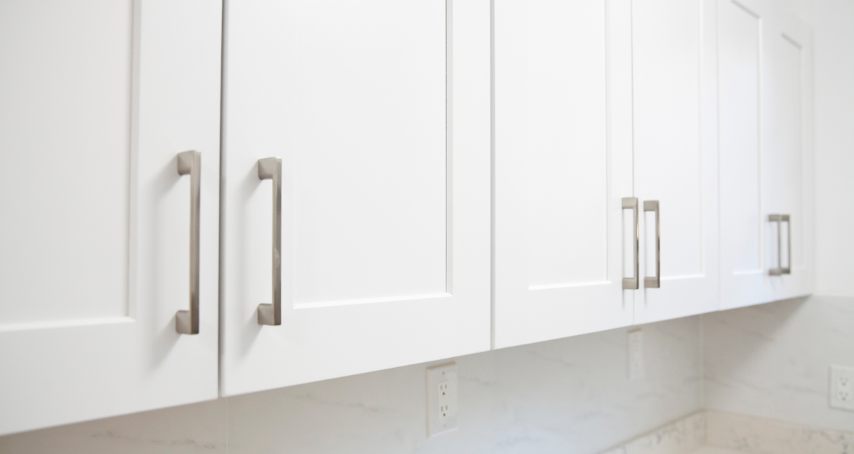 A white wall with white doors.