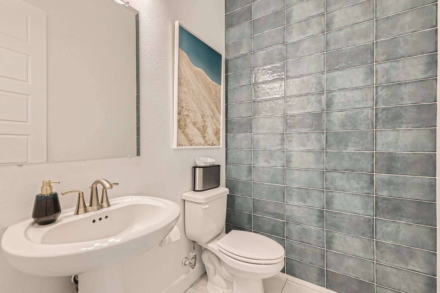A bathroom with a toilet and sink.
