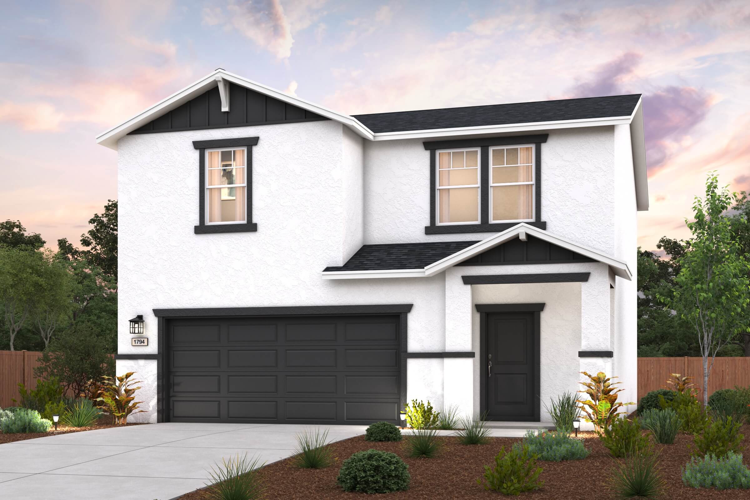 A white house with a garage.