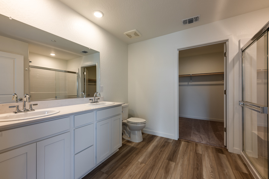 A bathroom with a toilet and sink.