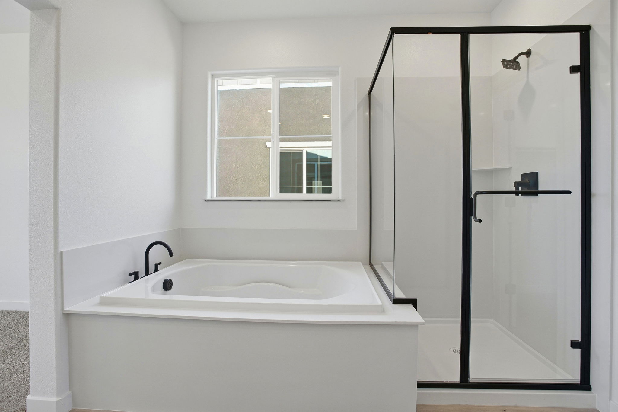 A bathroom with a glass shower.