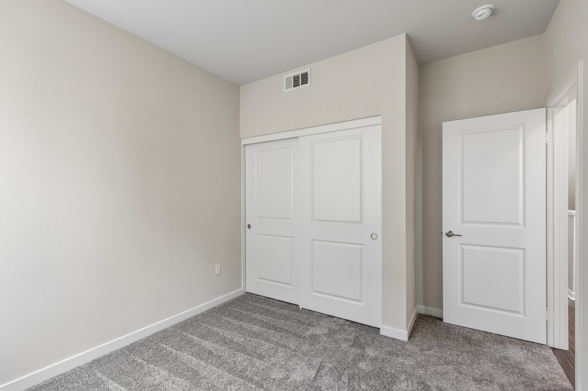 A room with white doors.