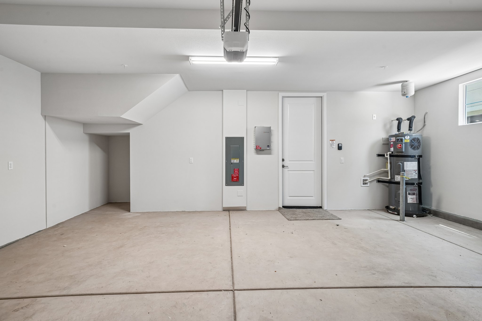 A room with white walls and a white door.