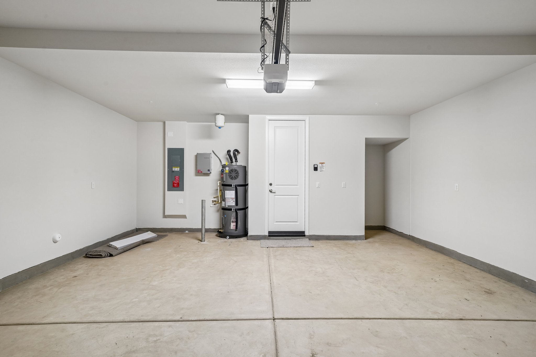 A room with white walls and a white door.