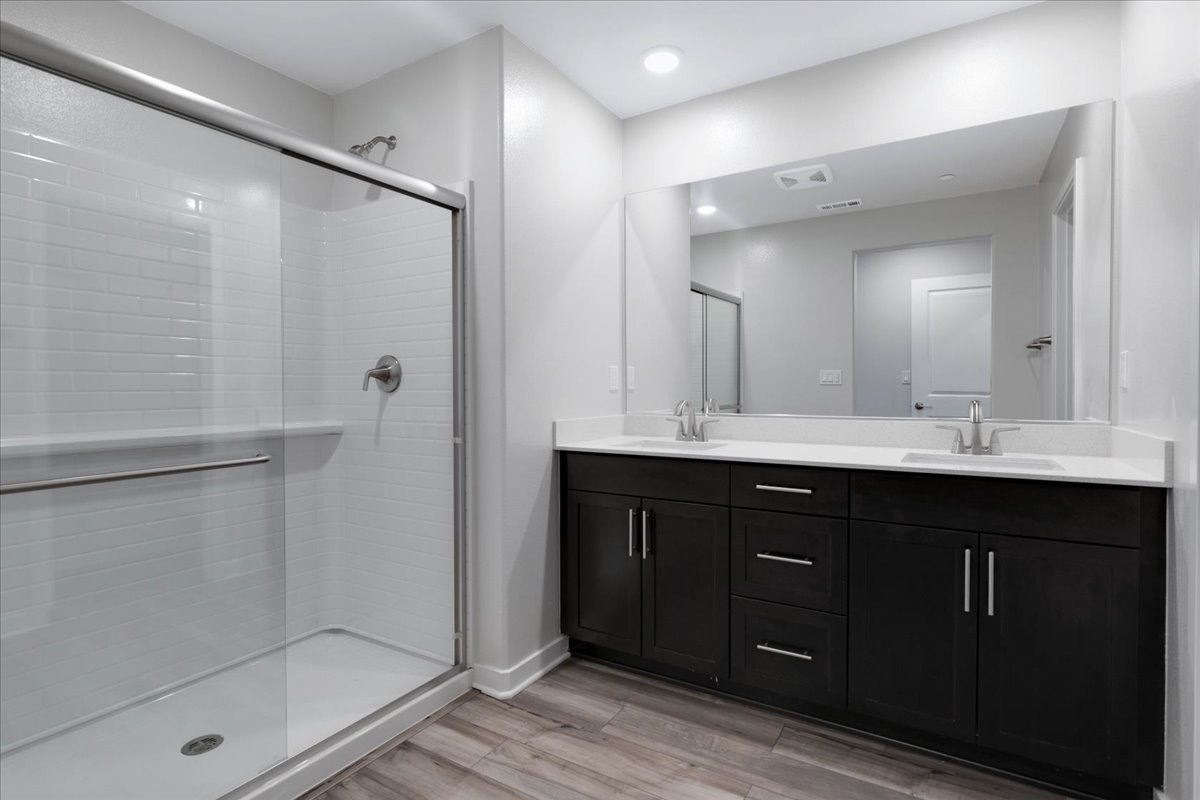 A bathroom with a glass shower.