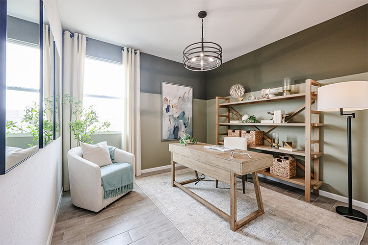 A living room with a table and shelves.