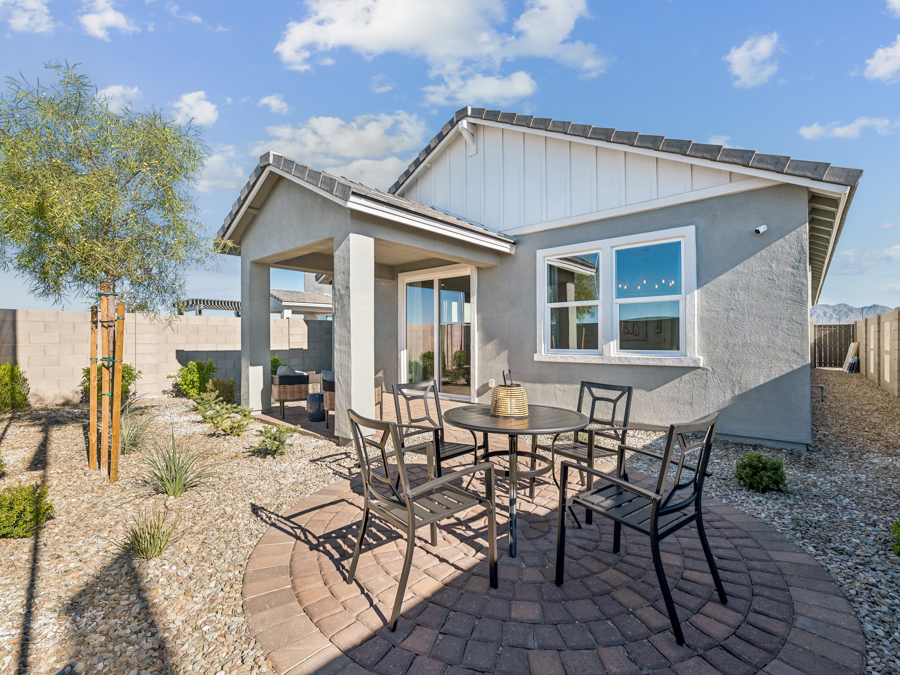 A patio with a table and chairs.