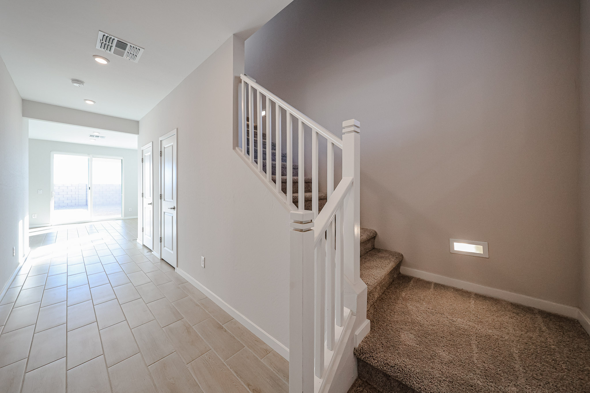 A white staircase in a house.