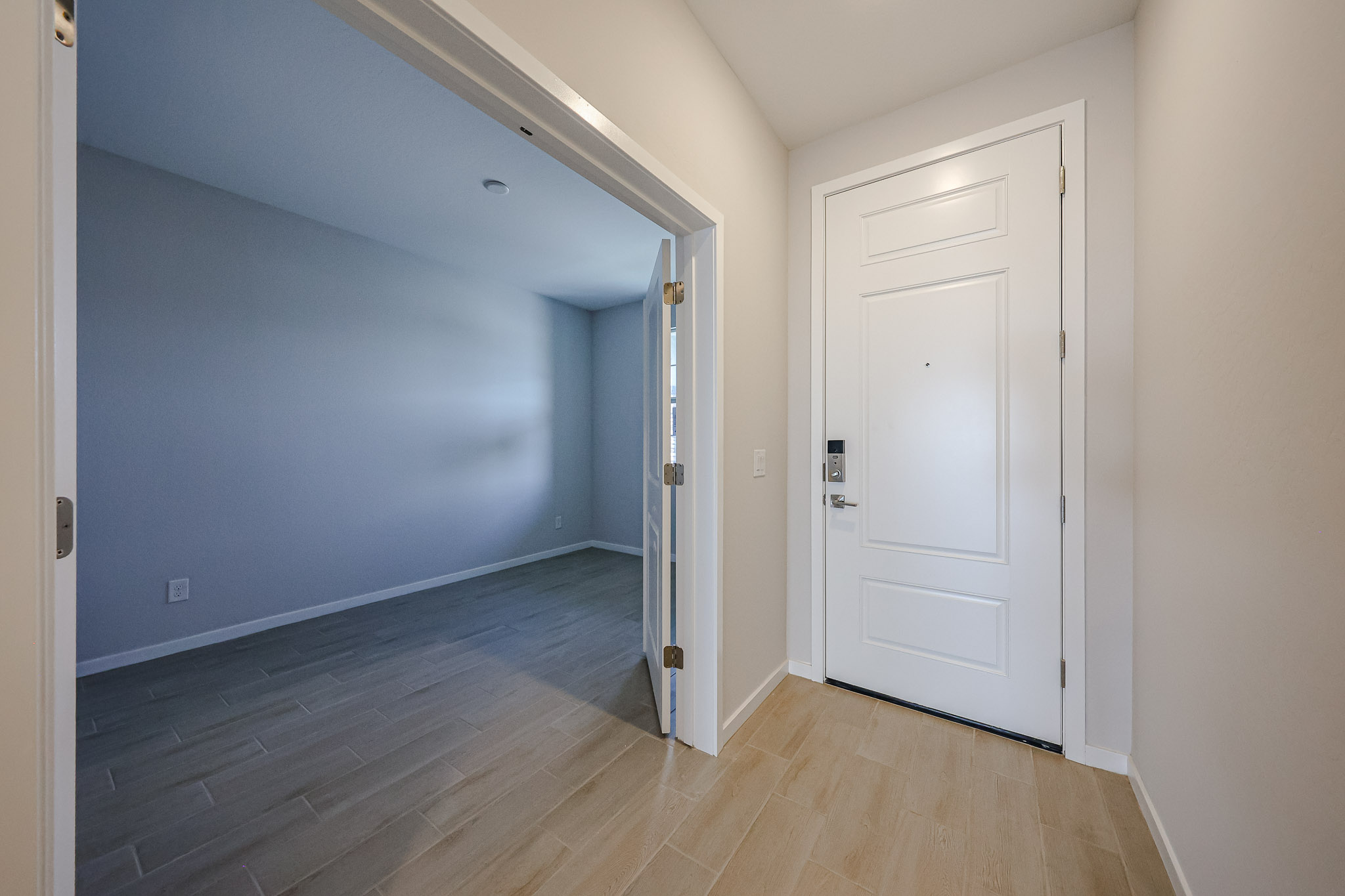 A hallway with white doors.