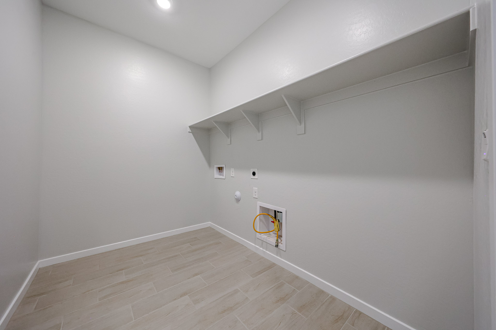 A room with a wood floor and a wood floor.