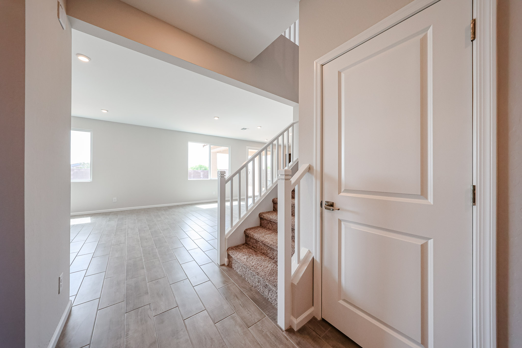 A hallway with white doors.
