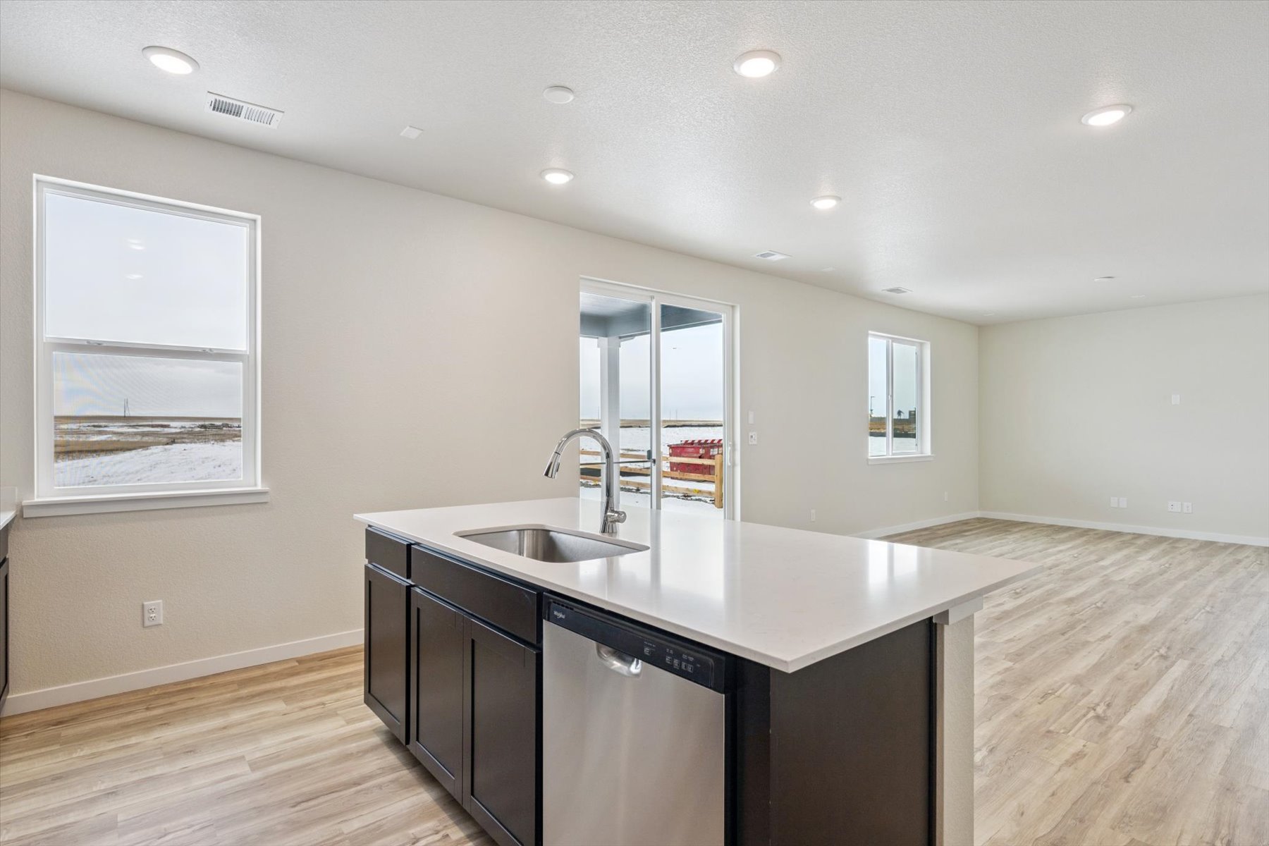 A kitchen with a sink and cabinets.
