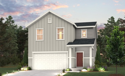 A white house with a garage.
