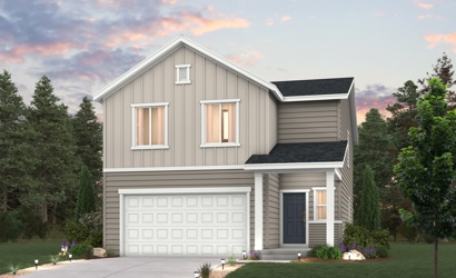 A house with a garage and trees around it.