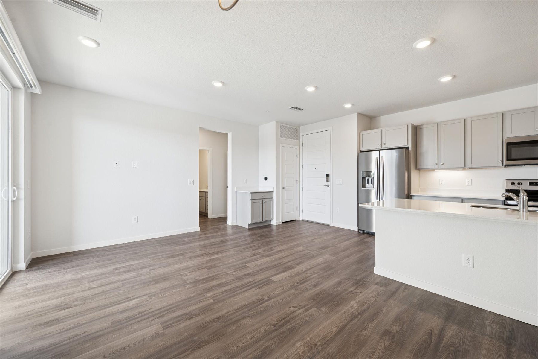 A large kitchen with white cabinets.