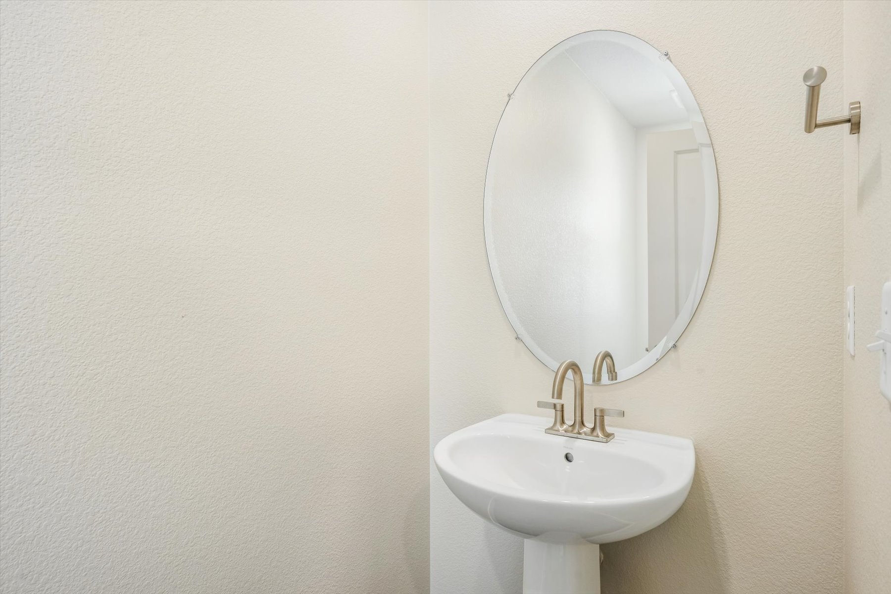 A mirror above a sink.