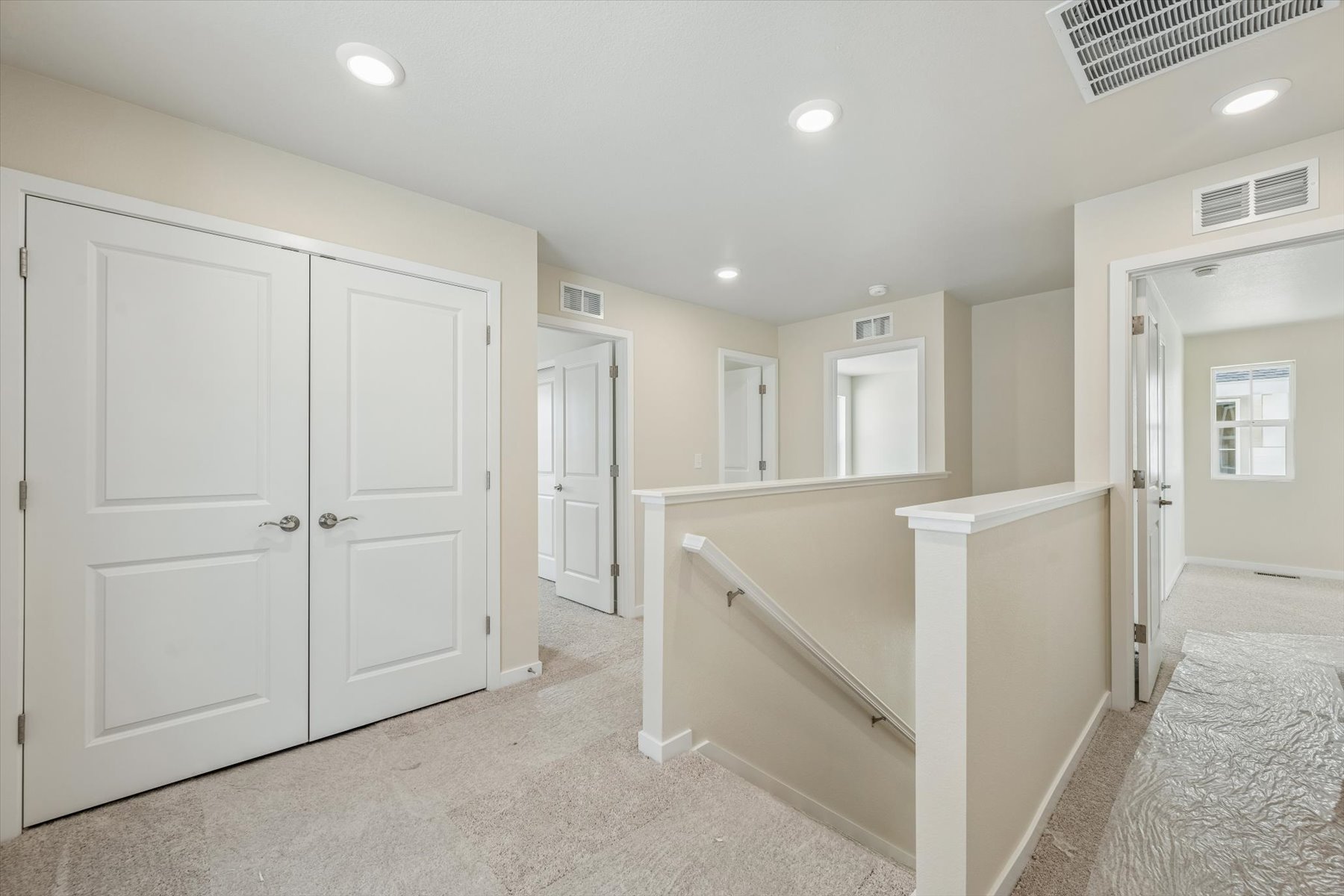 A room with white cabinets.