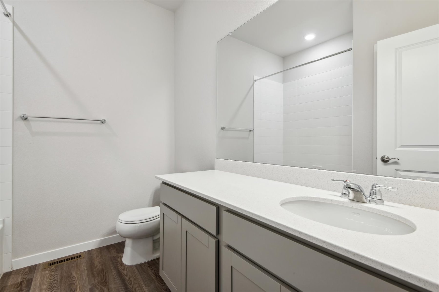 A bathroom with a sink and a toilet.
