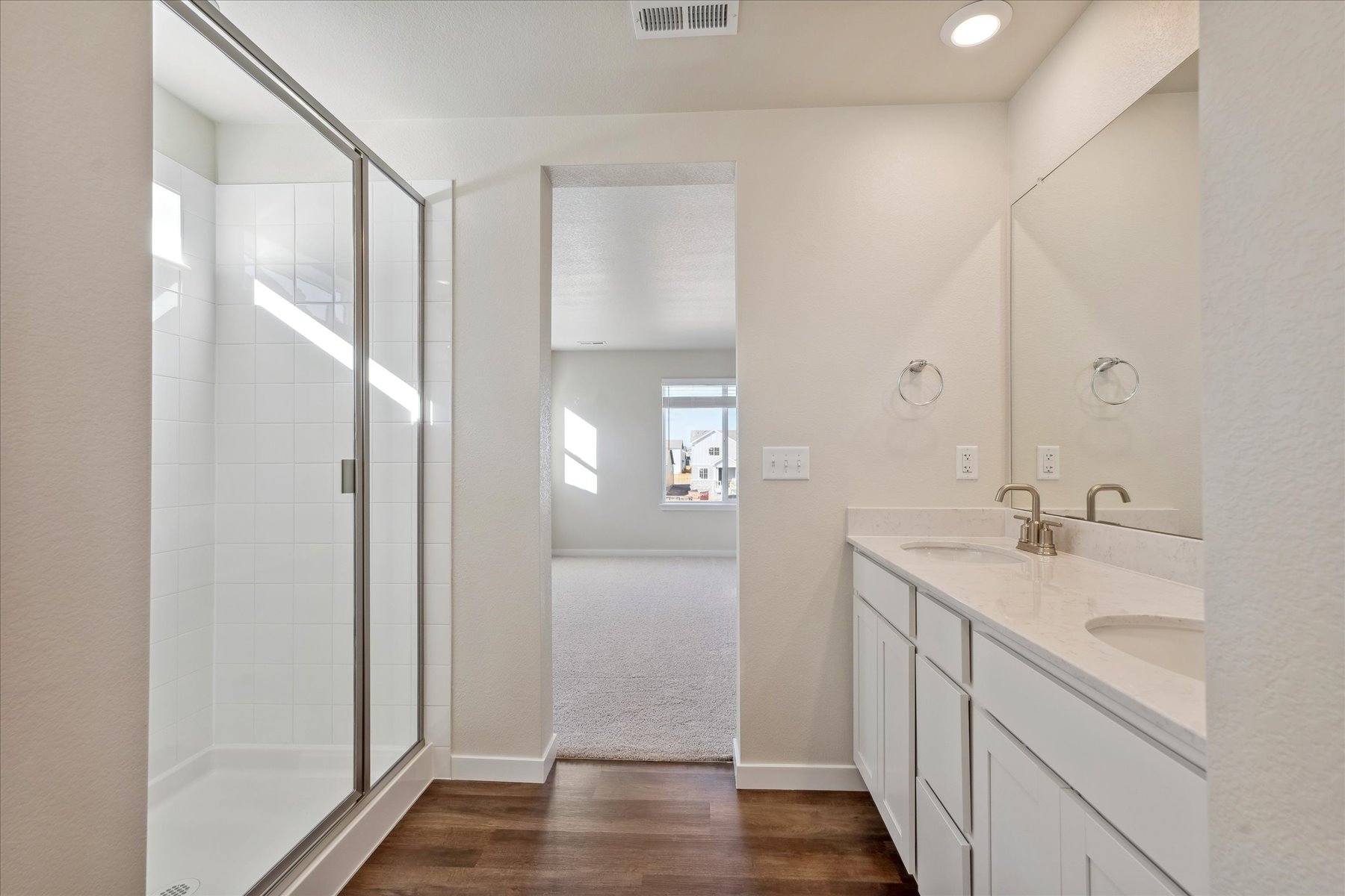 A bathroom with a glass shower.