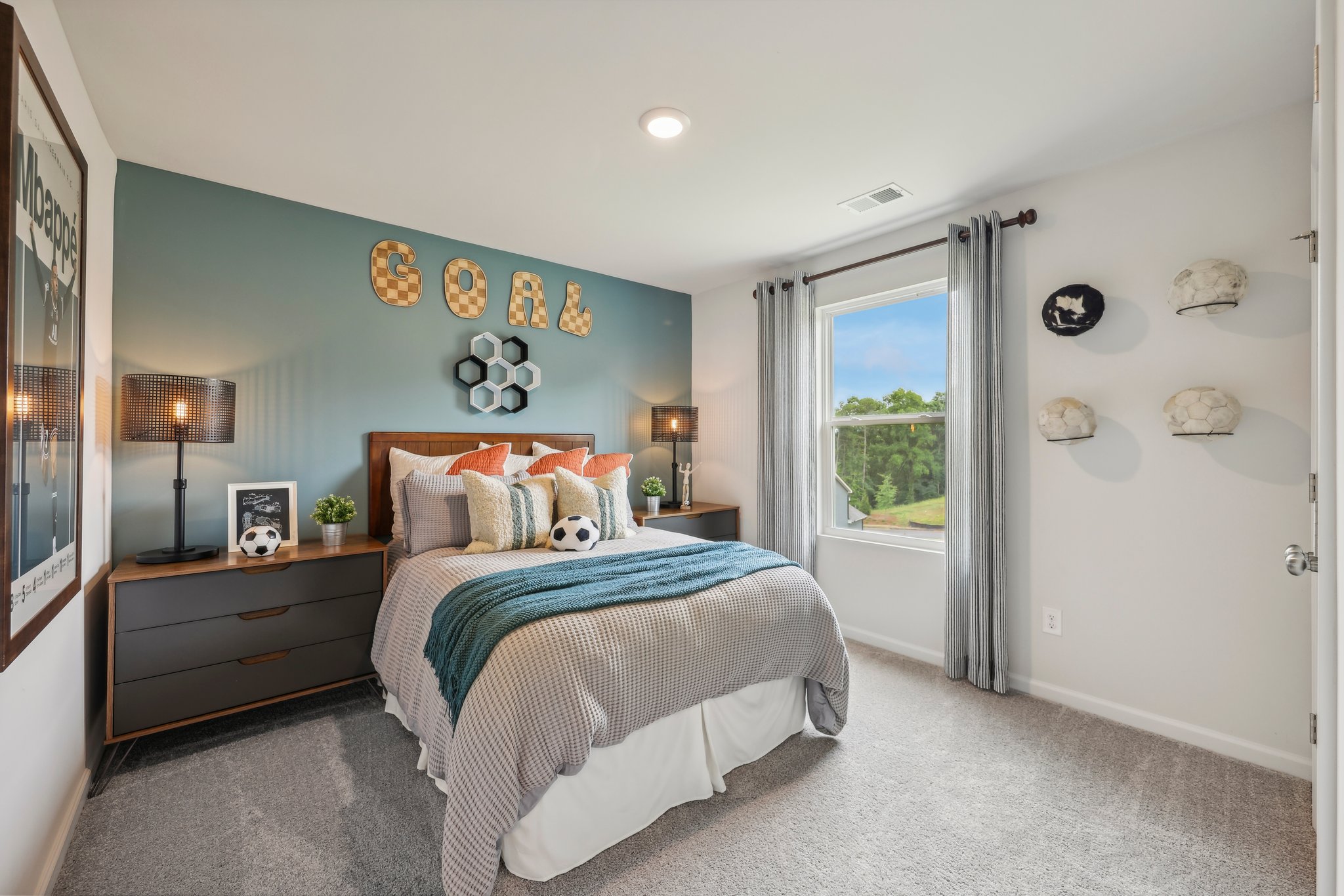 A bedroom with a bed and a window.