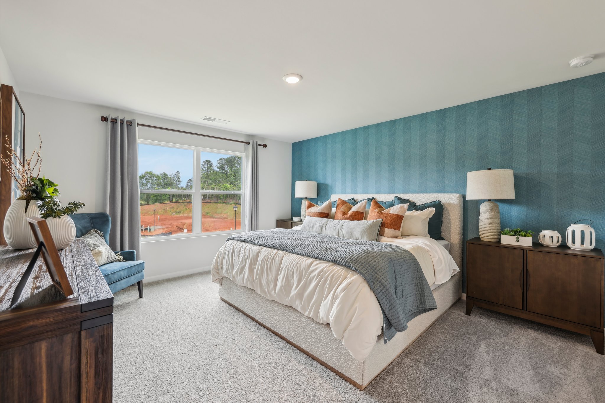 A bedroom with a bed and a window.