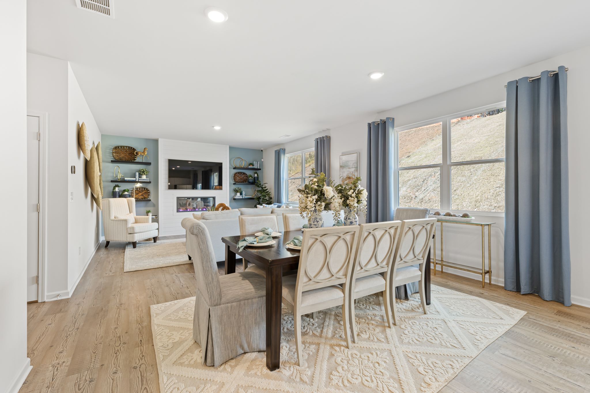 A dining room with a large table.