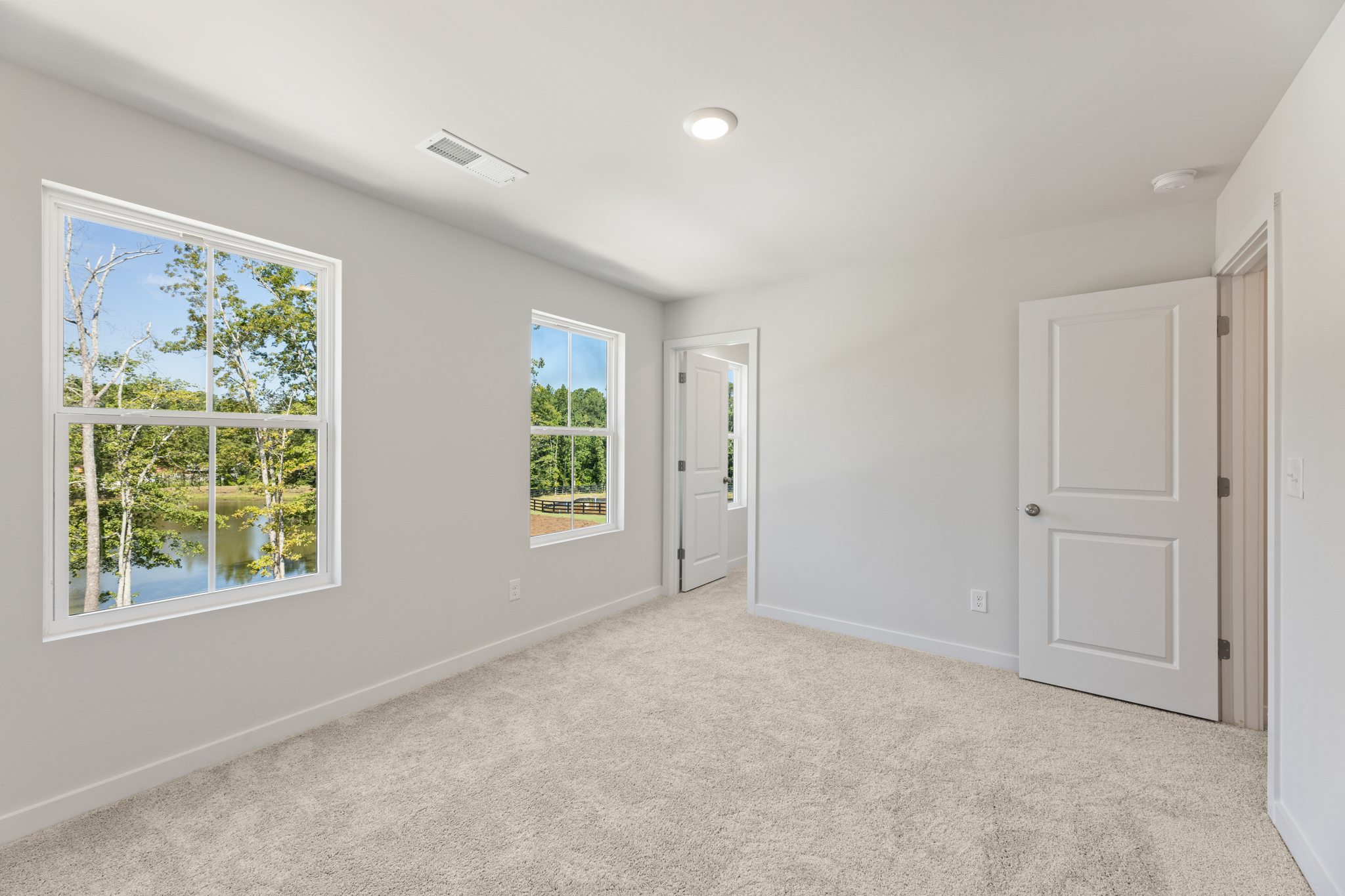 A room with white walls and windows.