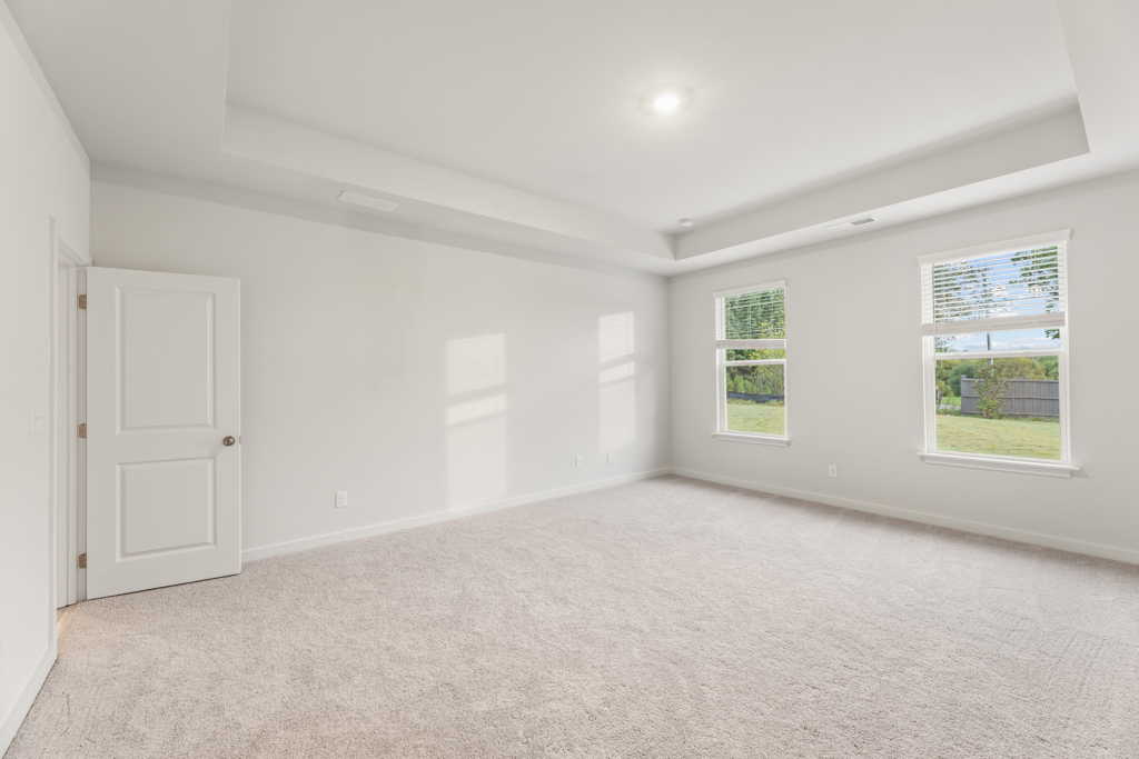 A room with white walls and windows.