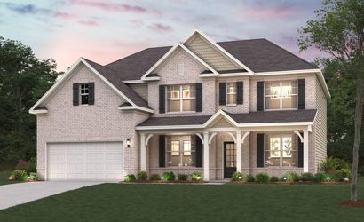 A large house with a lawn in front of it.
