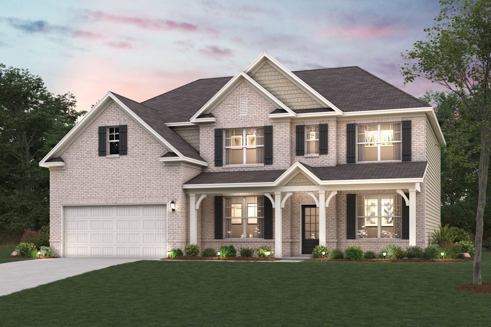 A large house with a lawn in front of it.
