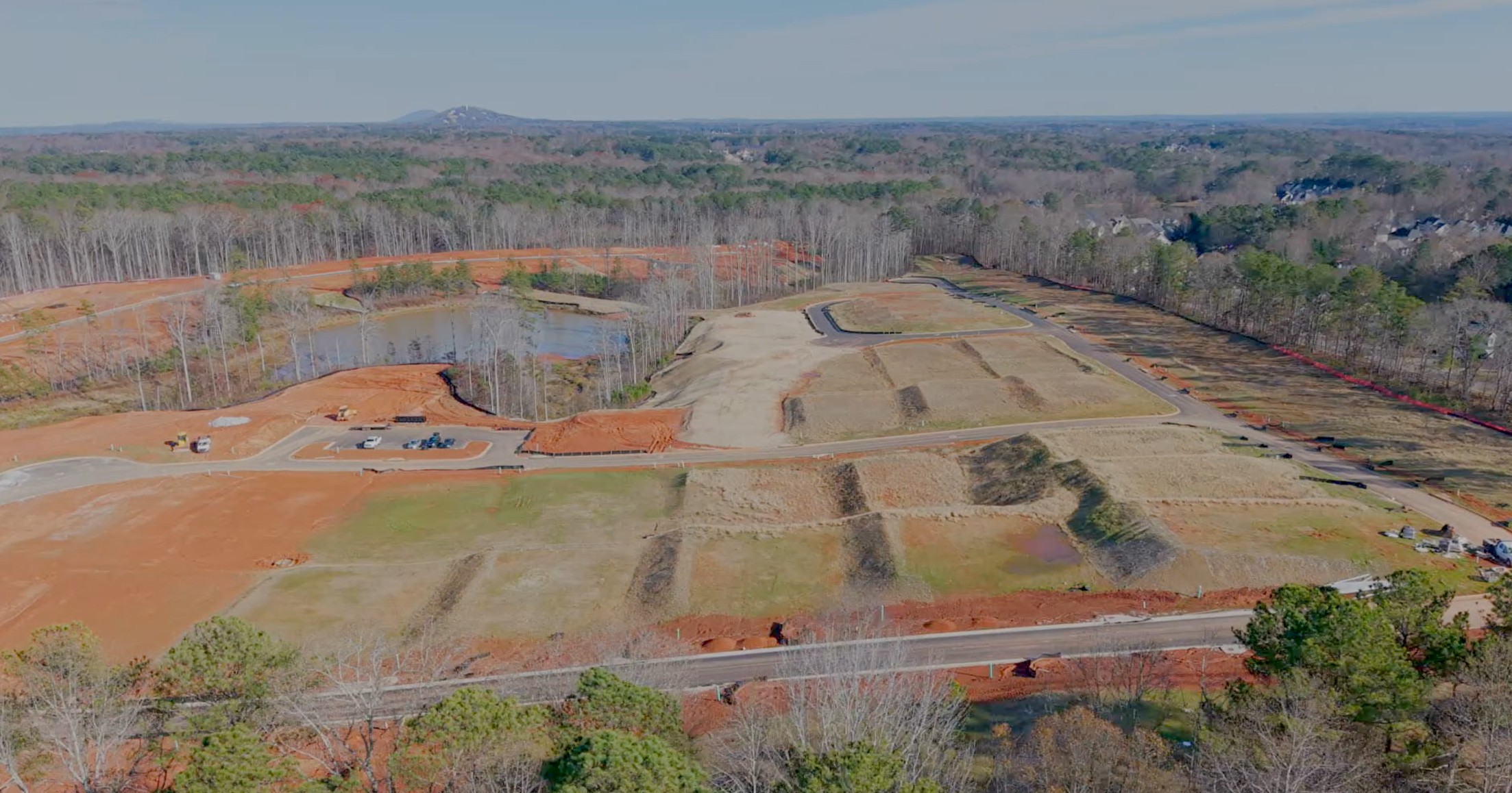 A landscape with a river and trees.
