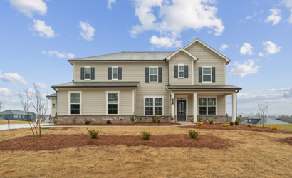 A house with a dirt yard.