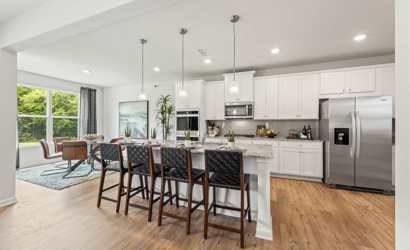 A kitchen with a wood floor.