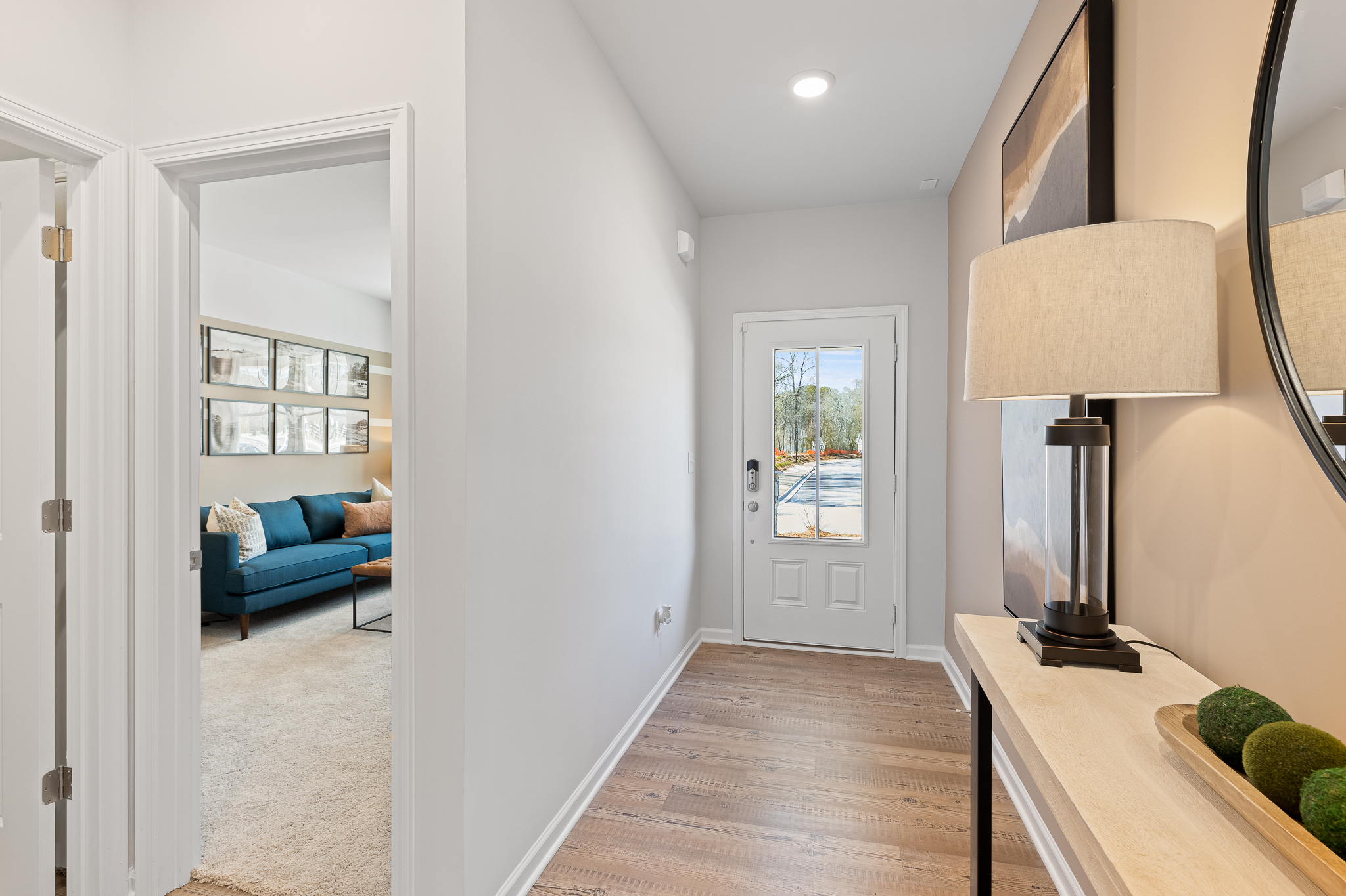 A living room with a blue couch.