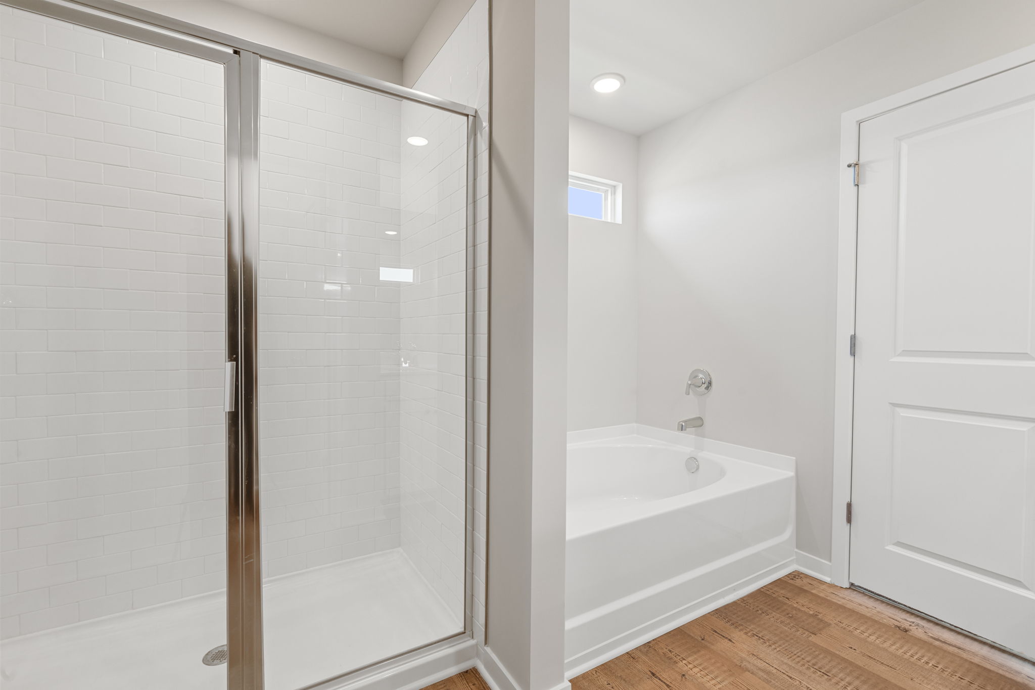 A bathroom with a glass shower.