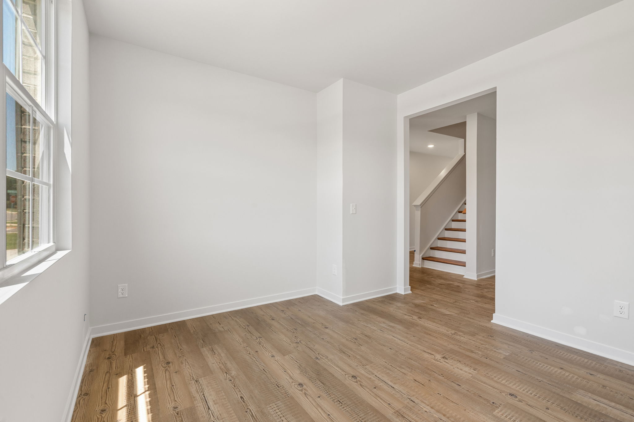 A room with a wood floor and a wood floor.