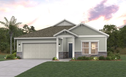 A house with a garage and trees in the back.