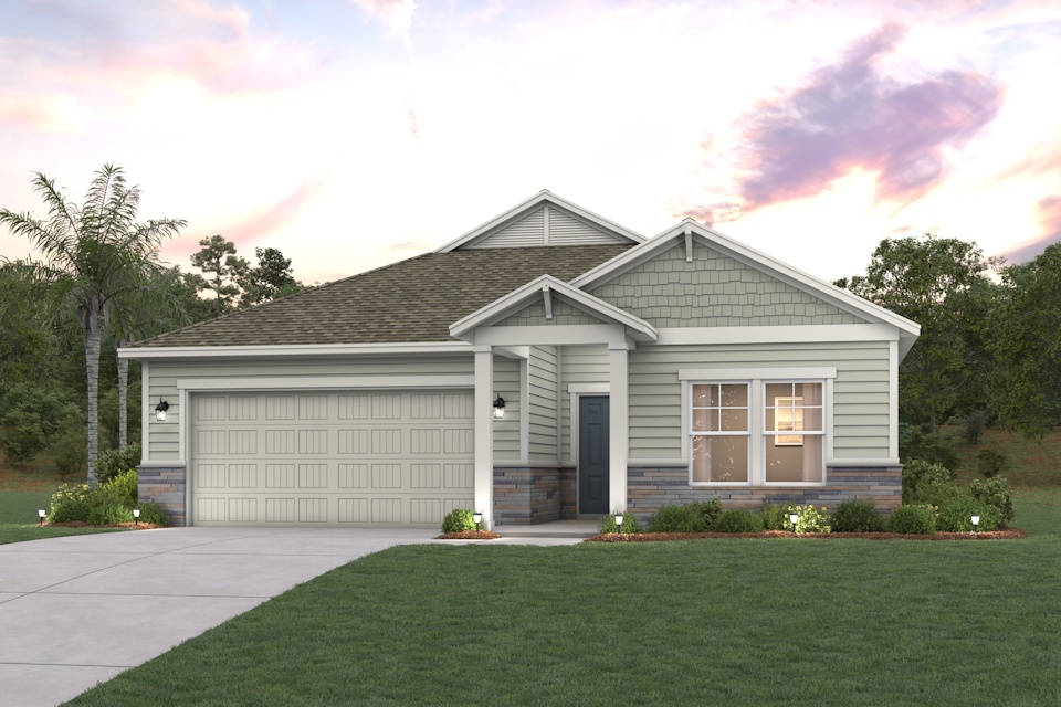 A house with a garage and trees in the back.