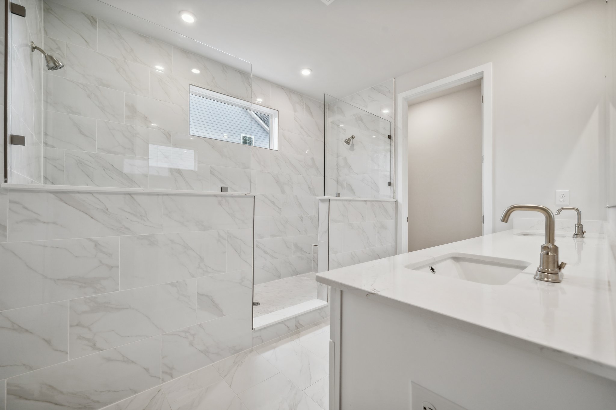 A bathroom with a glass shower.