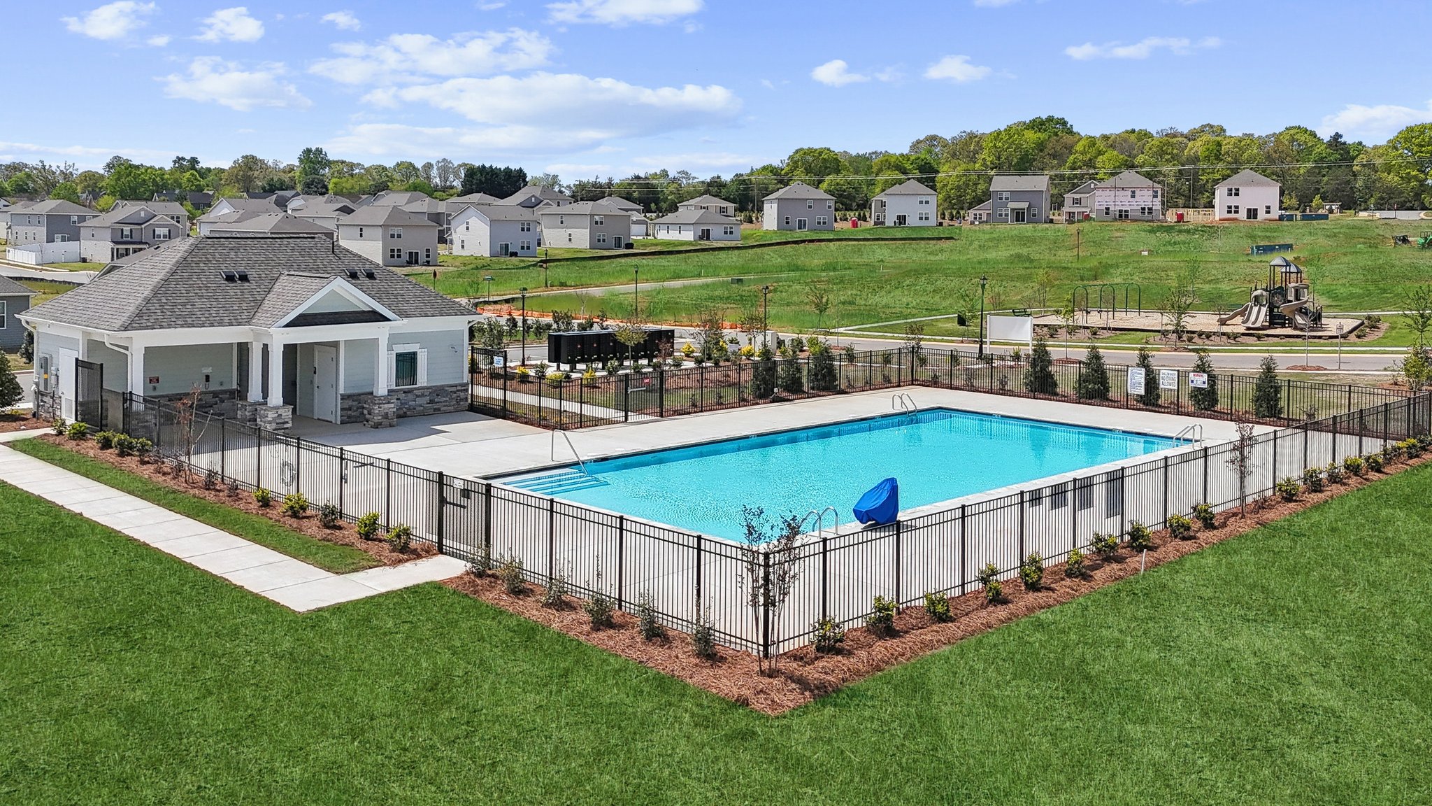 A swimming pool in a backyard.