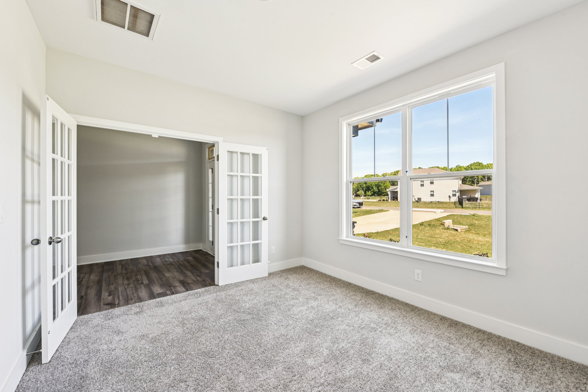 A room with a door and windows.