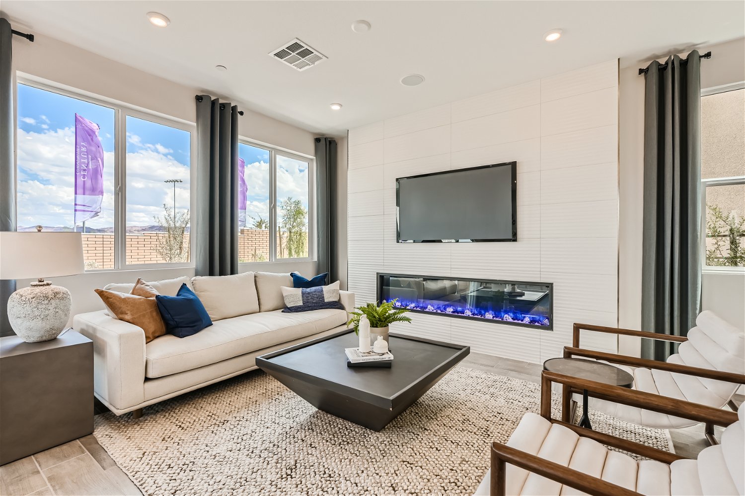 A living room with a tv and couches.