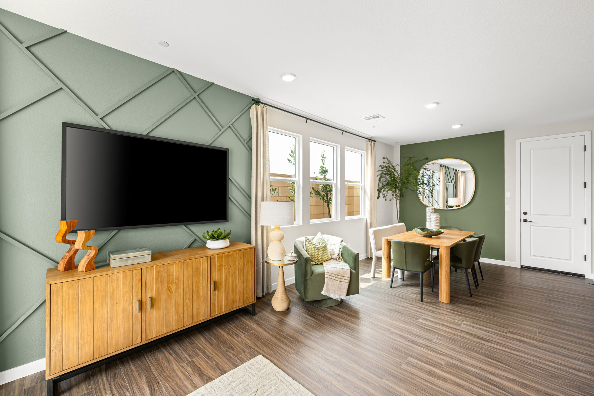 A living room with a tv and a table.