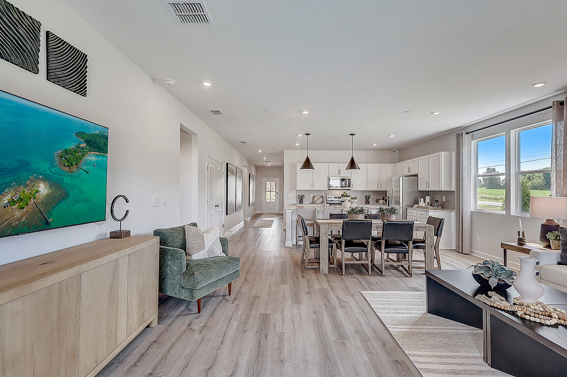 A large kitchen with a dining room.