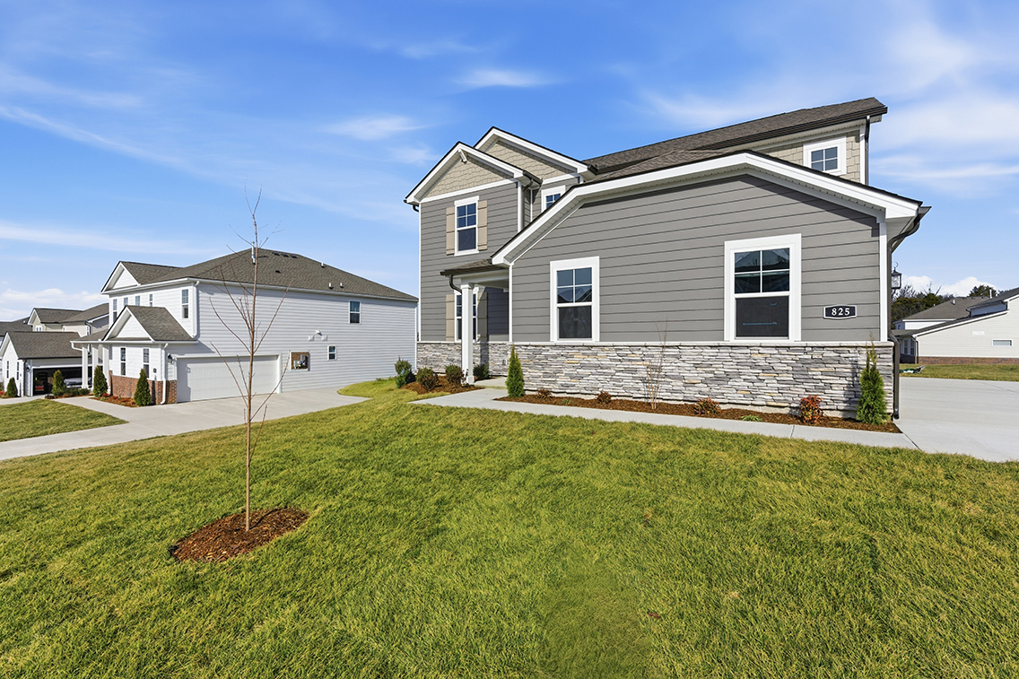 A house with a large front yard.