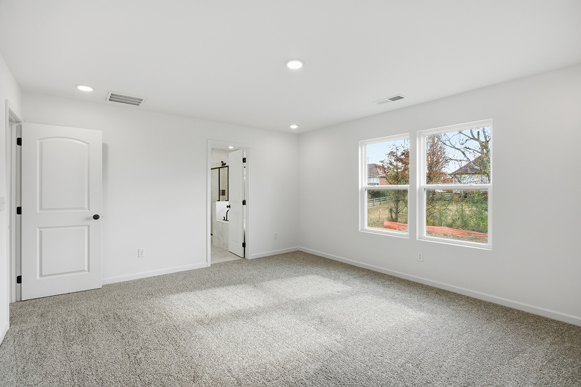 A room with white walls and windows.