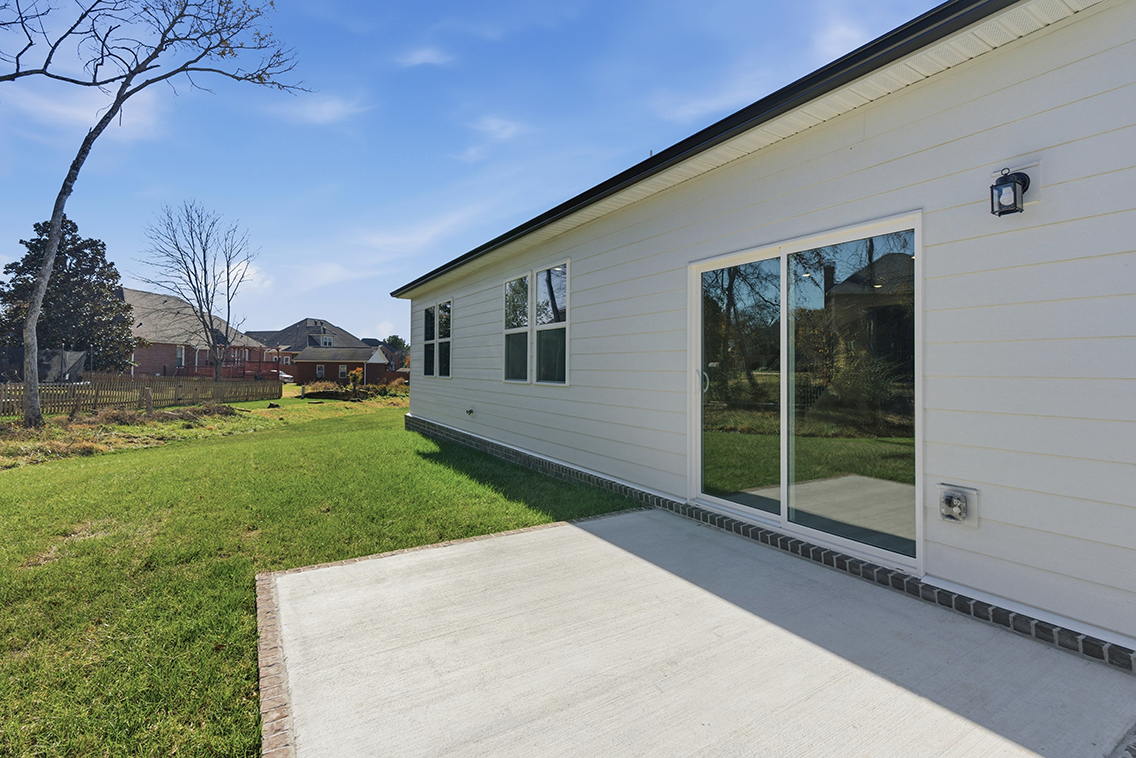 A white house with a glass door.