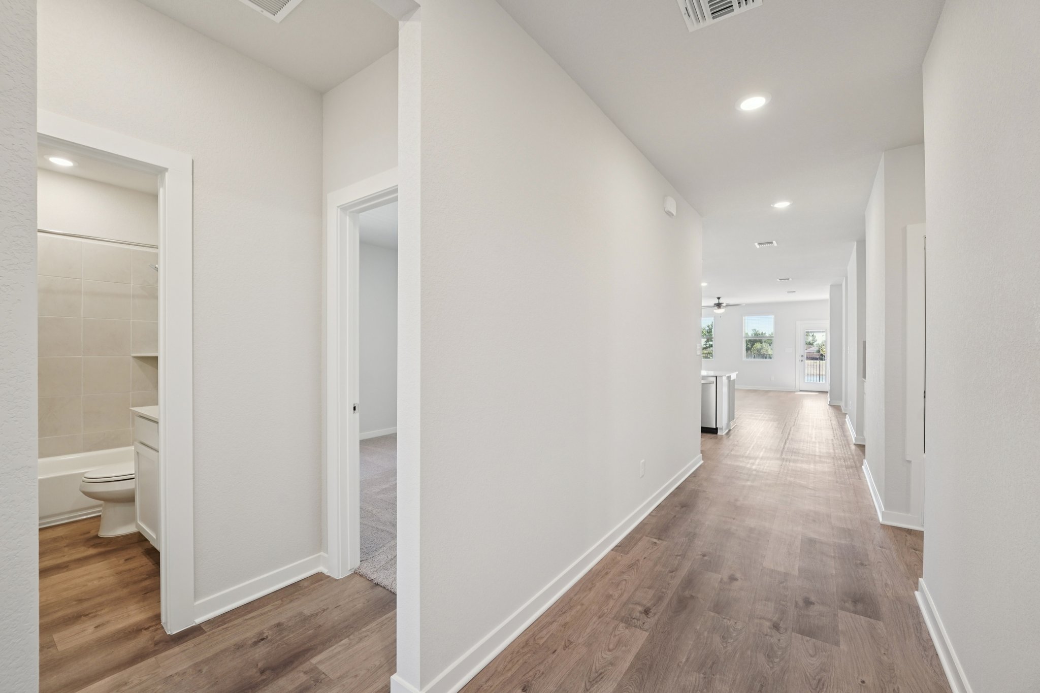 A bathroom with white walls.