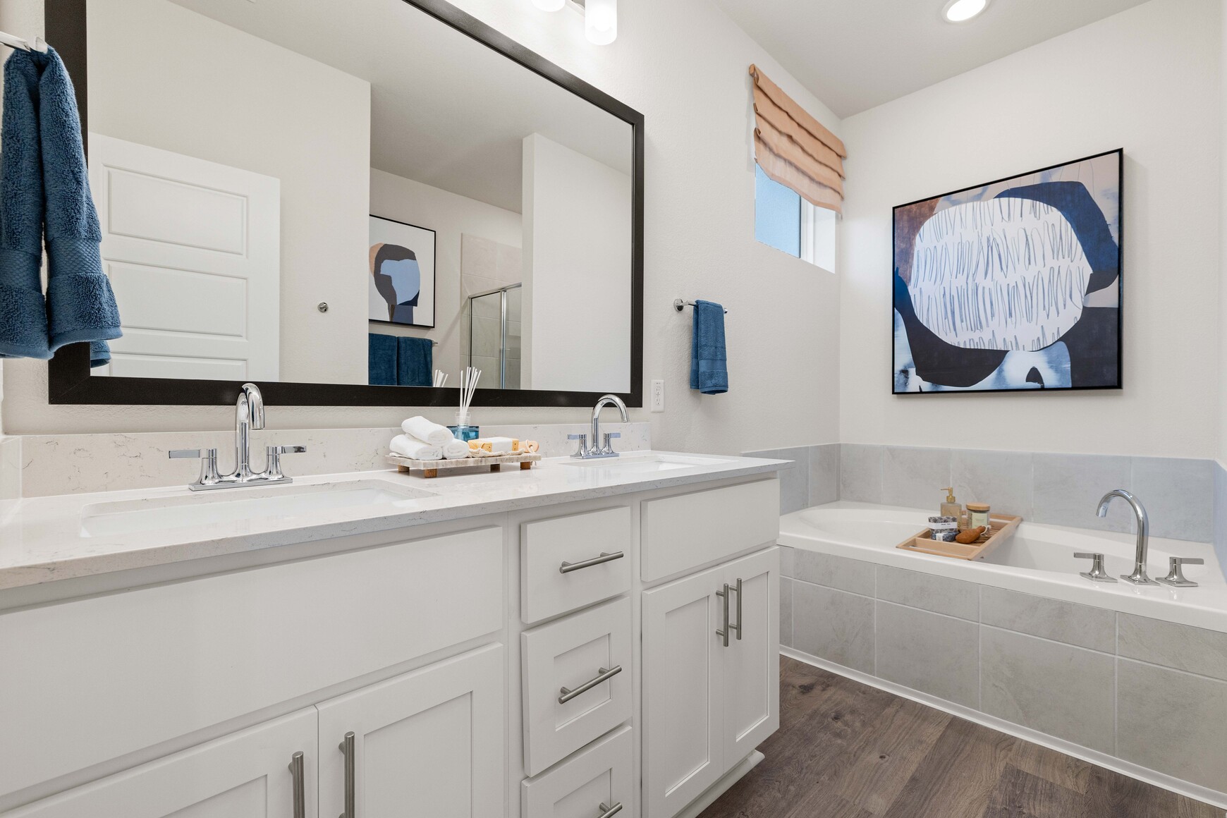A bathroom with a large mirror.